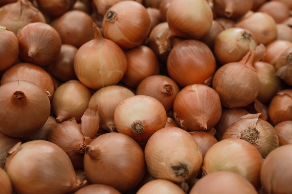Pile of fresh brown onions, the key ingredient in honey onion cough syrup